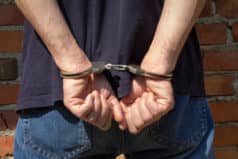 Person in handcuffs for date rape drug charges