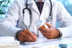 pharmacist writing a prescription for drugs obtained legally