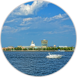 image of town surrounded by water with boat