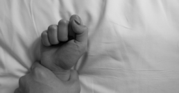 Featured image Man's hand holding a woman hand for sexual abuse.
