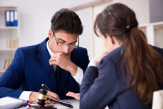 An attorney going over paperwork with a client.